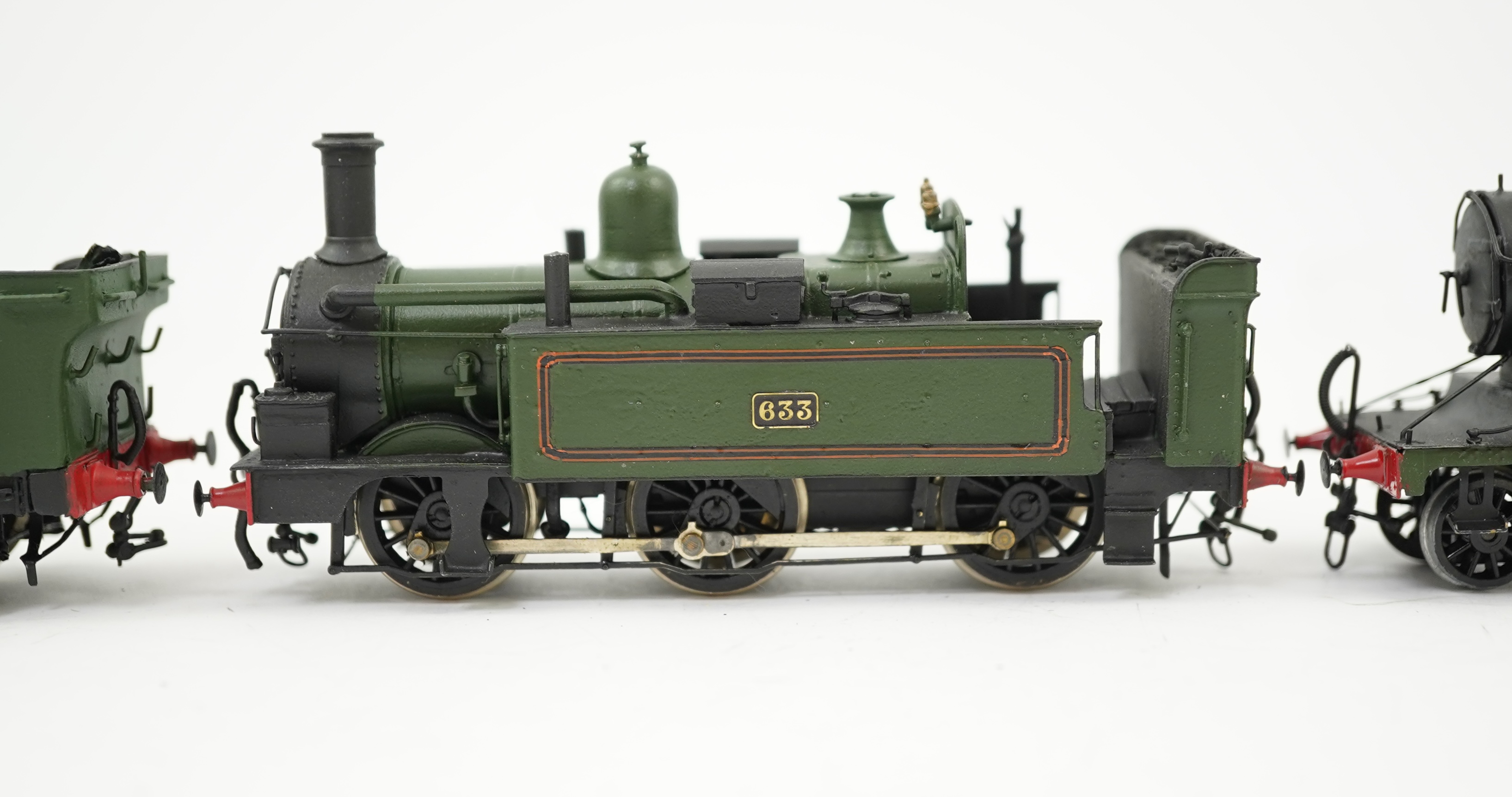 Four 00 gauge kit built GWR tank locomotives, three brass and white metal; a 14xx class 2-4-0T, 1458, together with an 517 class 0-4-2T, 574, and a 633 class 0-4-2T, 633, plus a plastic/resin and metal 46xx class 4-4-2T,